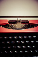 Close up of the letters on an old typewriter with paper. Retro style.