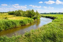 Curved Stream In A Rural Landscape In The Summer Season