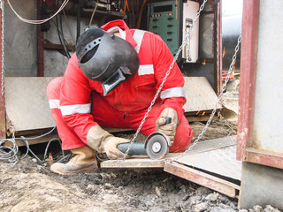 Wall Mural - Safety at work. Welding and grinding of iron constructions. Industrial weekdays welders and fitters