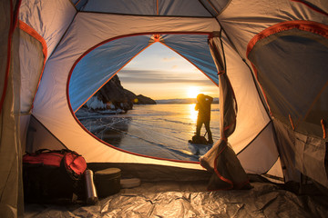 sunrise inside a tent. camping concept