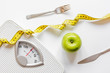 © 279photo - floor scale and apple on white background top view