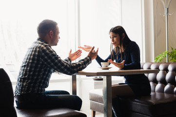 Scene in cafe - couple conflict arguing during the lunch.