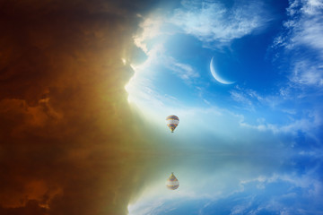 Wall Mural - idyllic heavenly background - colorful hot air balloon flies in