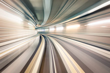Subway Underground Tunnel With Blurry Rail Tracks In Metro Gallery - Modern Concept Of Public Transport And Connection - Radial Zoomed Speedness Of Railway Space - Soft Focus Due To Motion Blur