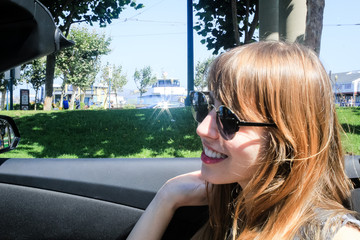 Poster - Young Girl in a Convertible at San Francisco, California