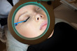 © fotofrol - Cosmetology. Beautiful girl in a magnifying glass.