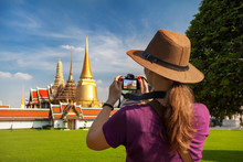 Woman Tourist With Camera In Bangkok