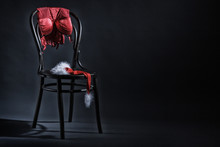 Women's Underwear And Hat Of Santa Claus Hanging On A Retro Chair. Erotic Christmas Motif.