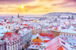 Prague in Christmas time, classical view on snowy roofs in central part of city.