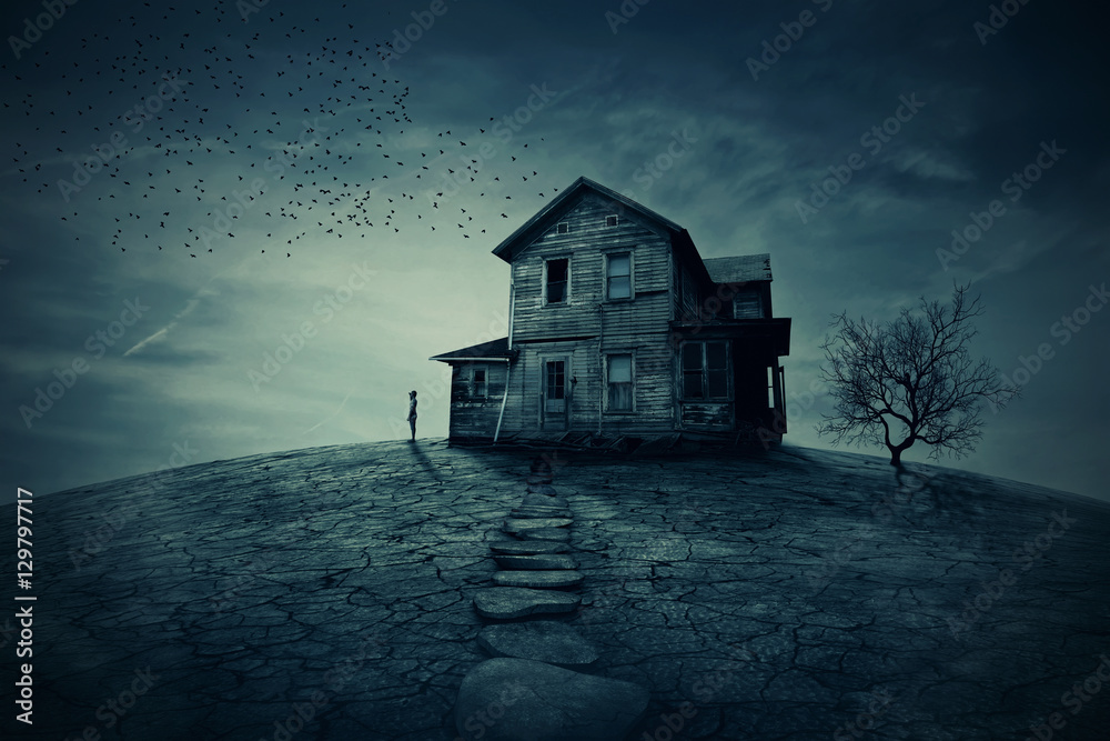 Home Return. Young man stand at the corner of a ravaged house, looking far away for someone. A ghost, desolated house with a dry land and tree.  - obrazy, fototapety, plakaty 