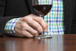© Jne Valokuvaus - Business man is enjoying a glass of red wine.