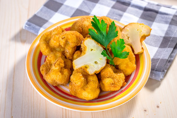 Poster - Breaded fried cauliflower on wooden background