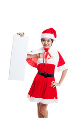 Wall Mural - Asian Christmas Santa Claus girl with blank sign.