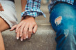 © gorynvd - A young couple in love touched hands on the first date