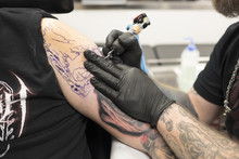 Sweden, Tattoo Artist Working On Arm Tattoo