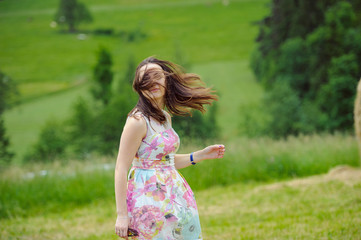 Brunette girl enjoying journey in mountains.