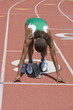 © MDBPIXS - African American female athlete ready to start race