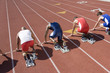 © MDBPIXS - Rear view of multiethnic runners at starting line ready to race