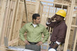© MDBPIXS - Engineer and foreman discussing plans while looking at each other