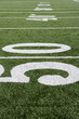 © moodboard - 50 yard line on American football field with artificial turf