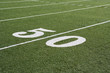 © moodboard - 50 yard line on American football field with artificial turf