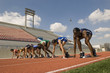 © moodboard - Group of diverse female athletes getting ready to start the race
