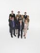 Full length group portrait of multiethnic businesspeople against white background