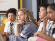 © MDBPIXS - Thoughtful elementary students sitting in classroom