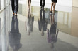 © MDBPIXS - Low section of business people walking on marble flooring in office