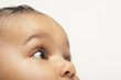 © moodboard - Closeup of baby boy looking up on white background