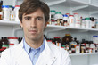 Portrait of confident male pharmacist in pharmacy