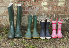 View Of A Variety Of Rubber Boots In A Row