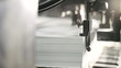 Printed sheets of paper are served in the printing press. Offset , CMYK