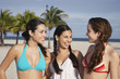 © MDBPIXS - Happy teenage girls in bikinis enjoying vacation on beach