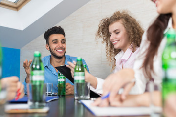 Canvas Print - Business People Group Sit At Office Desk Meeting, Young Smiling Businesspeople Team Conference Discussion Project Mix Race People Cooperation