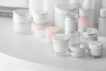 Poster - Set of cosmetics on white table, close up view