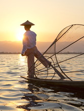 Intha 'leg Rowing' Fishermen Sunset On Inle Lake Who Row Traditional Wooden Boats Using Their Leg And Fish Using Nets Stretched Over Conical Bamboo Frames, Inle Lake