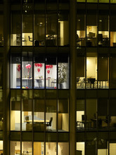 View Of Empty Office Decorated With Balloons After Party Through Window At Night