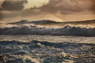 Wall Mural - sunset stormy ocean waves