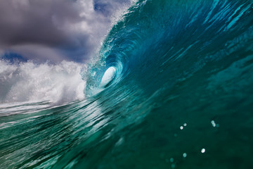 Wall Mural - bright clear blue ocean wave for surfing lessons