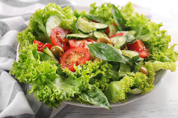 Wall Mural - Tasty vegetable salad on kitchen table