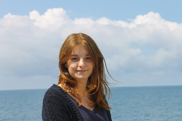 young girl on sea background