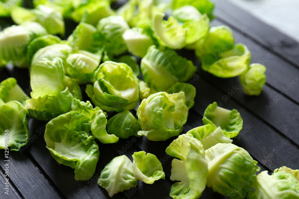 Closeup of Brussels sprouts on black wooden board