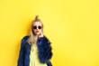 © Africa Studio - Young beautiful woman on yellow background