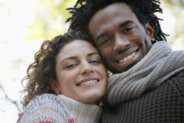 Closeup portrait of happy young multiethnic couple smiling