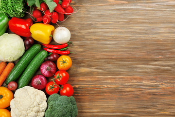 Wall Mural - Fresh vegetables on wooden background