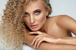 Beautiful Woman Model With Blonde Curly Hair And Soft Skin