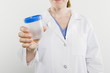 © moodboard - Midsection of a female nurse holding empty sample bottle isolated over white background