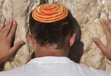 Close Up Of Young Man With Bright Yarmulka Praying At The Western Wall, Old City, Jerusalem, Israel