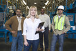 © moodboard - Group portrait of multiethnic operators standing in the factory